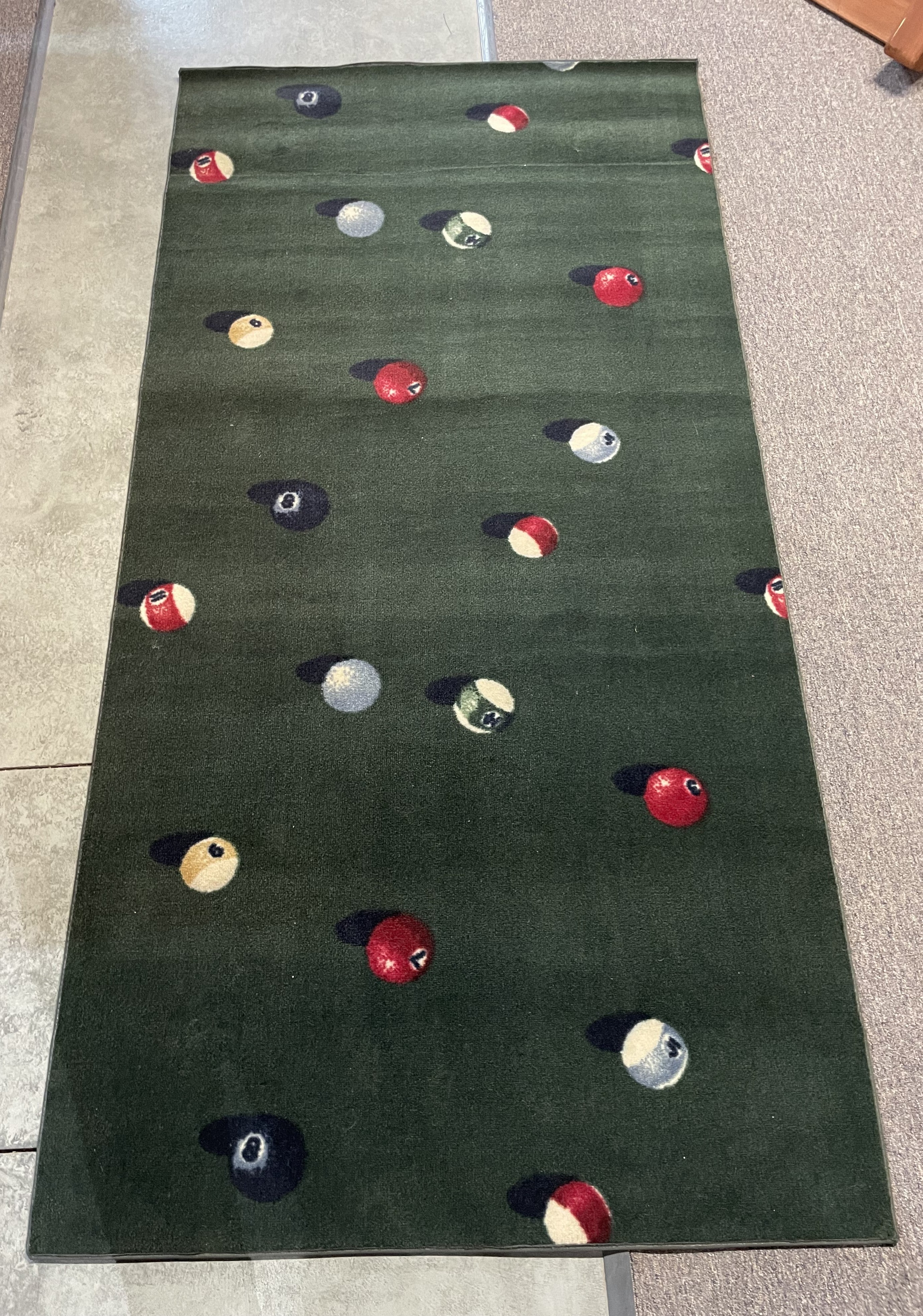 Themed rug for underneath pool table