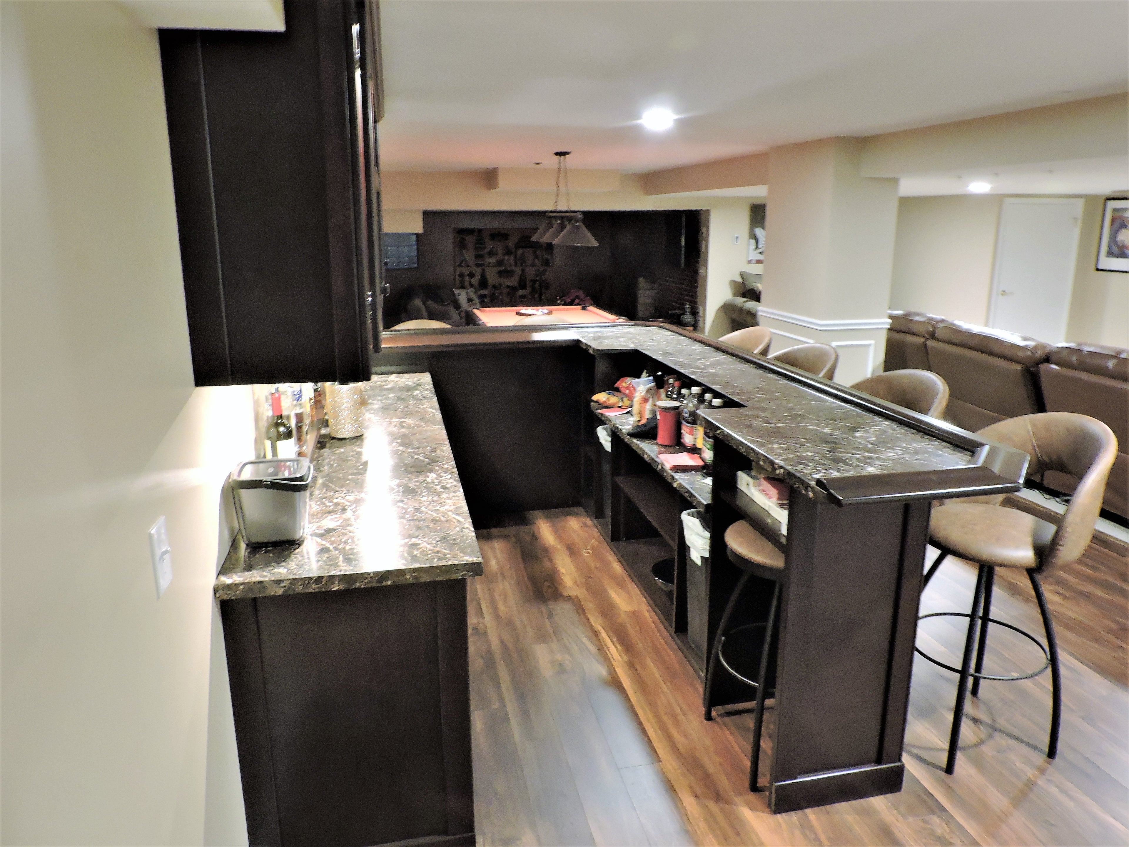 Gorgeous wrap around bar and billiard table.