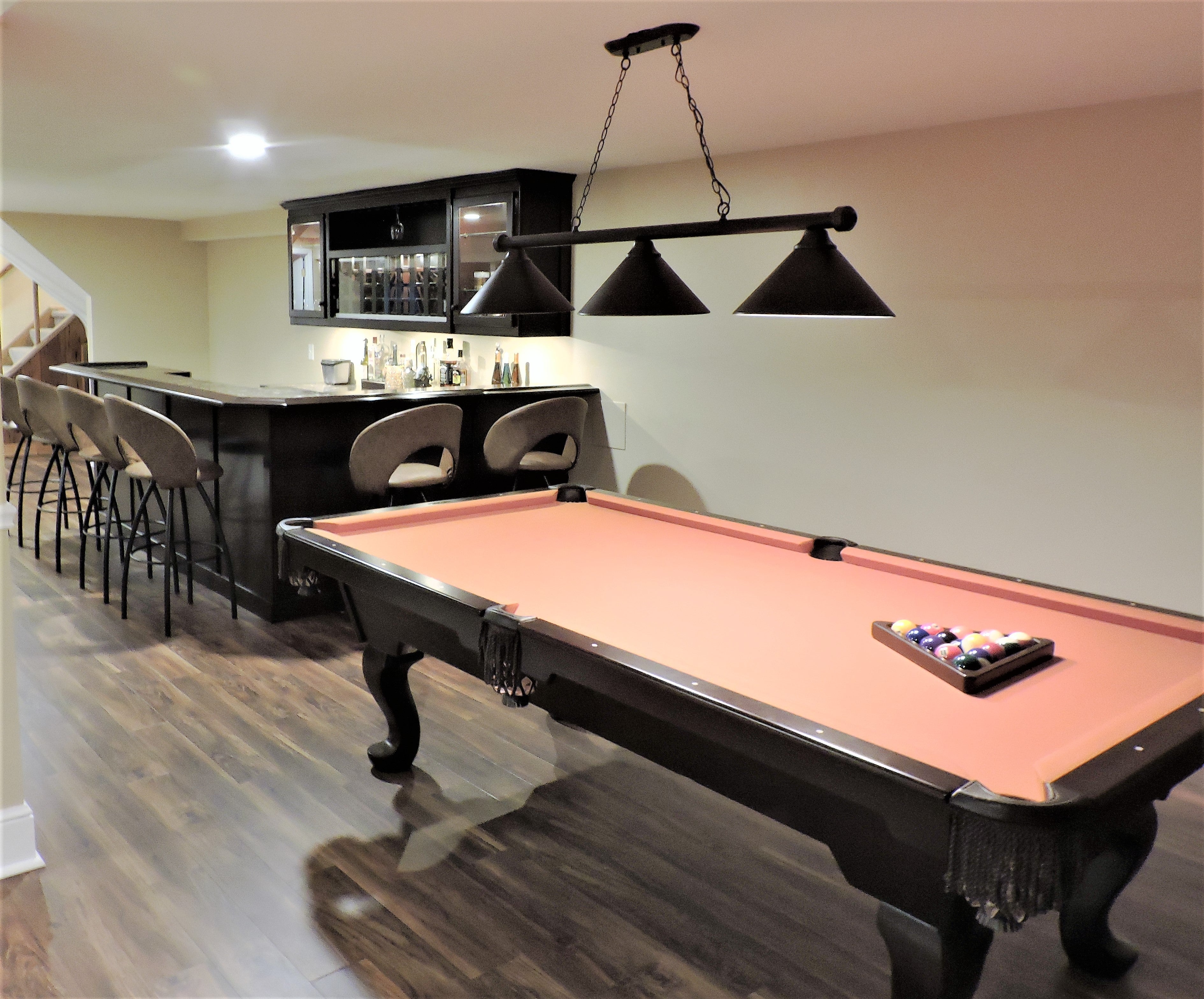 Gorgeous wrap around bar and billiard table.